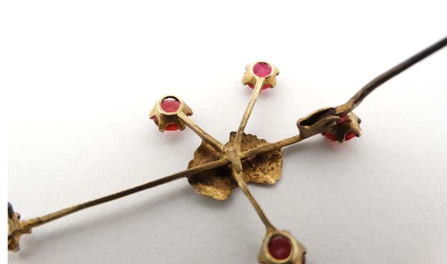 A 9ct gold ' Southern Cross' brooch with outline of Australia to centre and set with red stones. - Image 2 of 6
