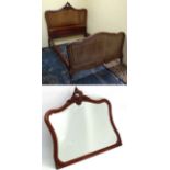 A French Louis XV style mahogany bed with carved Rococo crest together with matching mirror .