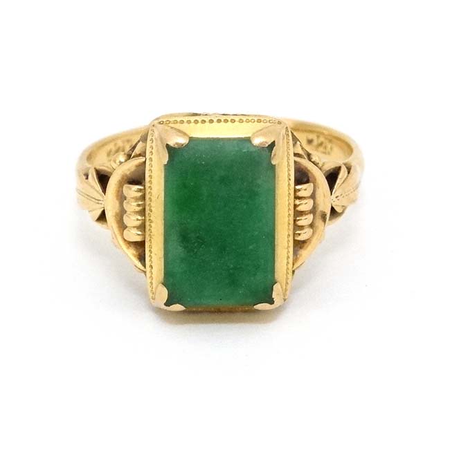 A Chinese 22ct gold ring set with jade like hardstone stone to top CONDITION: Please - Image 6 of 6