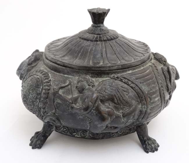 An early 20thC patinated bronze Grand Tour museum copy of a lidded urn after the antique depicting