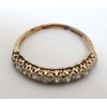 A 9ct gold ring set with band of diamonds CONDITION: Please Note - we do not make