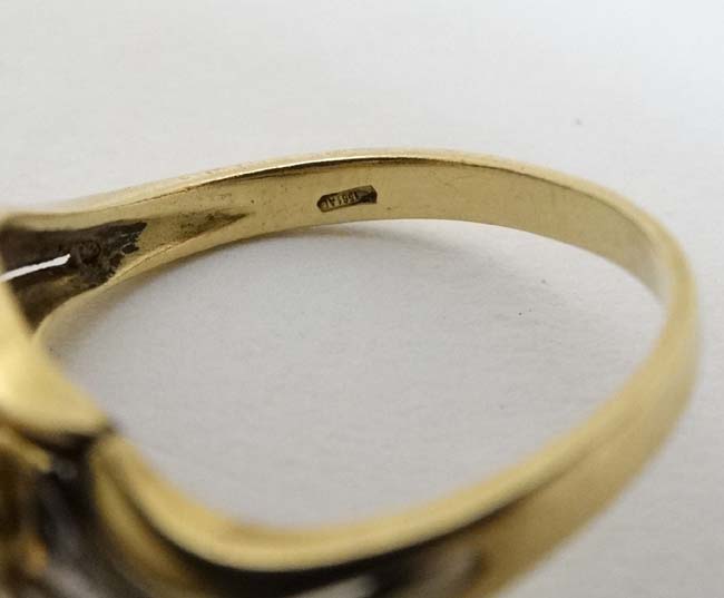 An unusual 18ct gold ring set with central sapphire in a foliate setting with chip set diamonds - Image 2 of 5