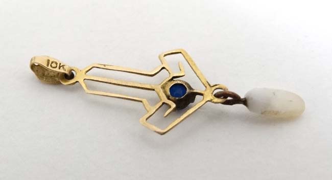 A 10k gold pedant set with blue stone and white chip drop 1” long CONDITION: Please - Image 2 of 5