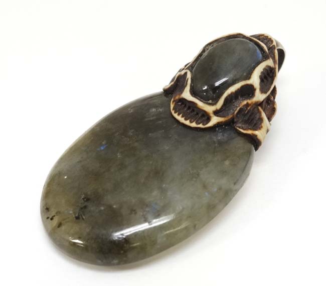 A pendant set with moss agate like hardstone cabochon 2 ¾” long CONDITION: Please