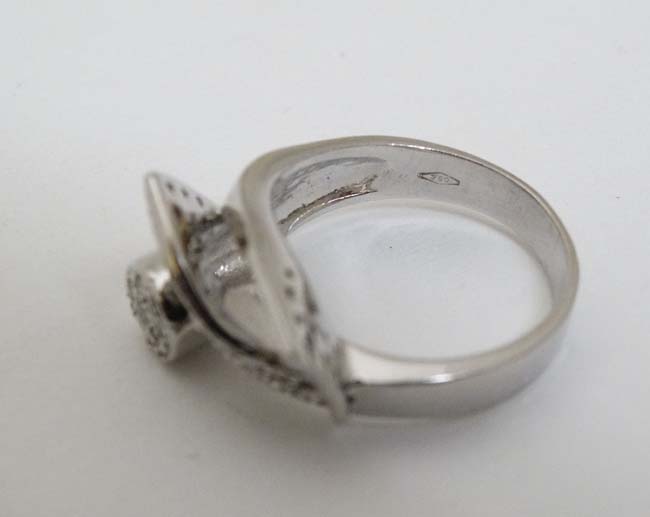 An 18ct white gold cocktail ring set with a profusion of diamonds CONDITION: Please - Image 2 of 3