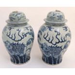 A large pair of Chinese blue and white lidded ovoid rice jars,