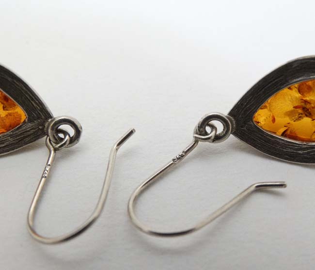 A pair of silver and white metal drop earrings set with amber. - Image 2 of 4