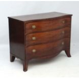 A Geo III mahogany serpentine fronted chest of drawers with splayed legs.