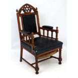 A 19thC oak reformed Gothic manner of Bruce Talbot oversized upholstered armchair 48" high x 26