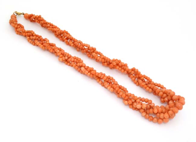 A vintage necklace of graduated coral beads.