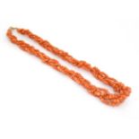 A vintage necklace of graduated coral beads.