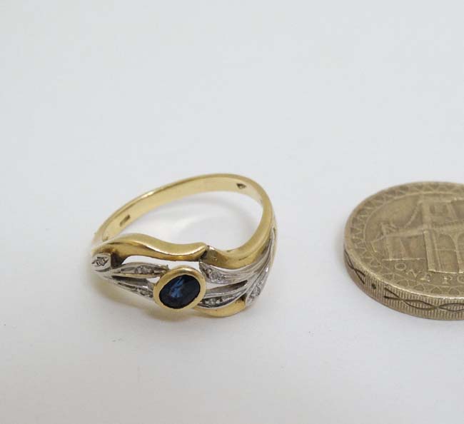 An unusual 18ct gold ring set with central sapphire in a foliate setting with chip set diamonds - Image 3 of 5