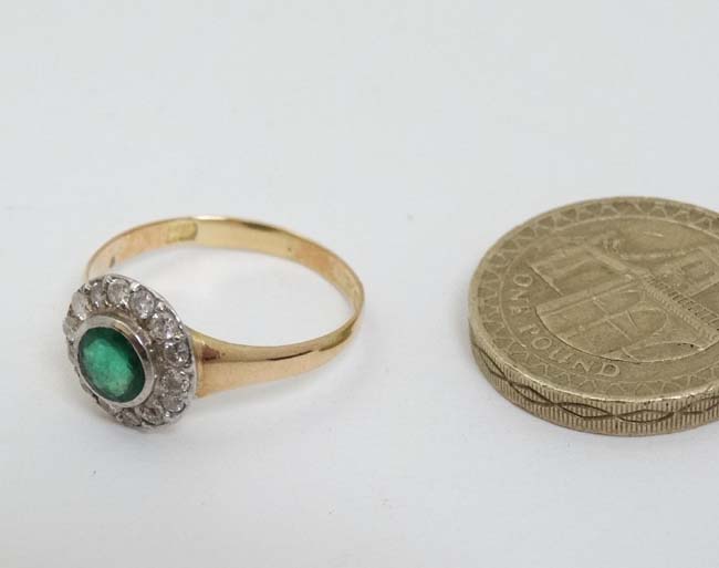 A 15ct gold ring set with central emerald bordered by diamonds CONDITION: Please - Image 3 of 5