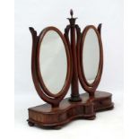 An unusual Victorian mahogany double hinged toilet mirror on cupids bow base with 2 shaped drawers