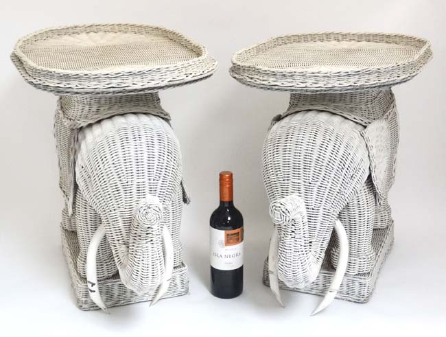 A pair of Lloyd Loom style novelty elephant formed occasional tables.