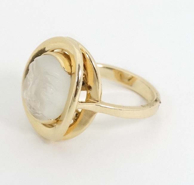 A 14k gold ring set with moonstone cabochon with man in the moon style face decoration. - Image 4 of 4