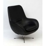 Vintage Retro : a Danish faux black leather swivel chair on a 4 spoke pedestal base ,