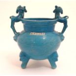 A Chinese turquoise three footed fangding form vase having twin handles formed as dogs of fo,