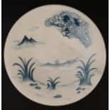 A Chinese blue and white crane dish decorated with crane and clouds above a wetland landscape,