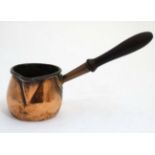 Benham and Froud : a 19 thC smaller copper saucepan with turned handle bearing the remáins of the