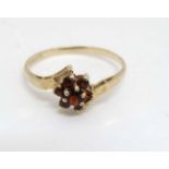 A 9ct gold ring set with garnets CONDITION: Please Note - we do not make reference