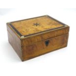 A late 19thC / early 20thC birds eye maple and burr wood box with inlaid geometric banding,