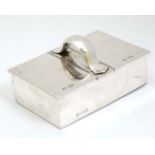 A silver two sectional table top cigarette box, with central handle,