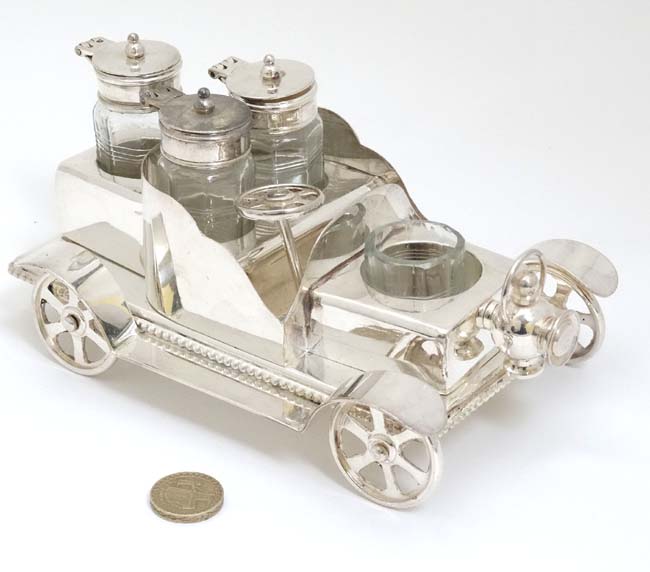 A novelty silver plate cruet set comprising 4 cruet bottles in stand formed as a vintage car. 21stC. - Image 3 of 4