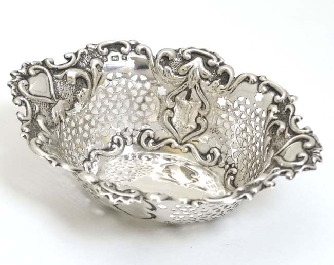 A silver bon bon dish with pierced and embossed decoration. - Image 3 of 5