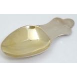 A silver caddy spoon with gilded bowl Hallmarked Birmingham 2002 with Golden Jubilee Mark.