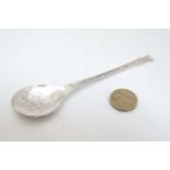 A silver Christmas spoon with Dickensian Carol Singers to bowl and holly decoration to handle.