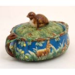A 20thC George Jones style Majolica twin handled lidded game tureen , marked 1679,