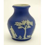 A late 19thC Wedgwood blue jasperware vase, having classical decoration to side. 4 1/2'' high .
