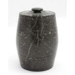 A barrel formed lidded jar of carved and polished green serpentine like stone.