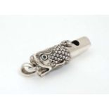 A silver whistle with Oriental Koi Dragon style decoration 1 1/2" long CONDITION: