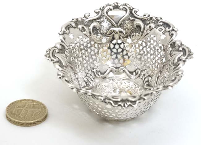 A silver bon bon dish with pierced and embossed decoration. - Image 4 of 5
