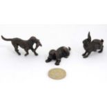 3 miniature cast models comprising hare, recumbent dog and dog retrieving pheasant.