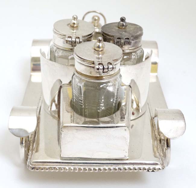 A novelty silver plate cruet set comprising 4 cruet bottles in stand formed as a vintage car. 21stC. - Image 4 of 4