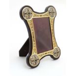 A fine photograph frame with Russian style white metal gilt and champ levre enamel and garnet