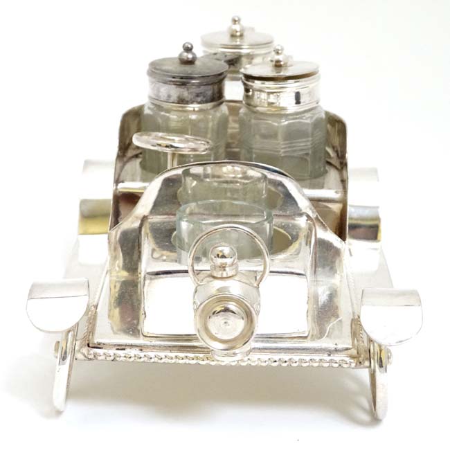 A novelty silver plate cruet set comprising 4 cruet bottles in stand formed as a vintage car. 21stC. - Image 2 of 4