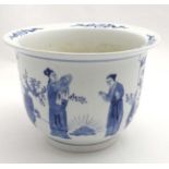 A large Chinese blue and white jardiniere the two panels decorated with figures in garden scenes