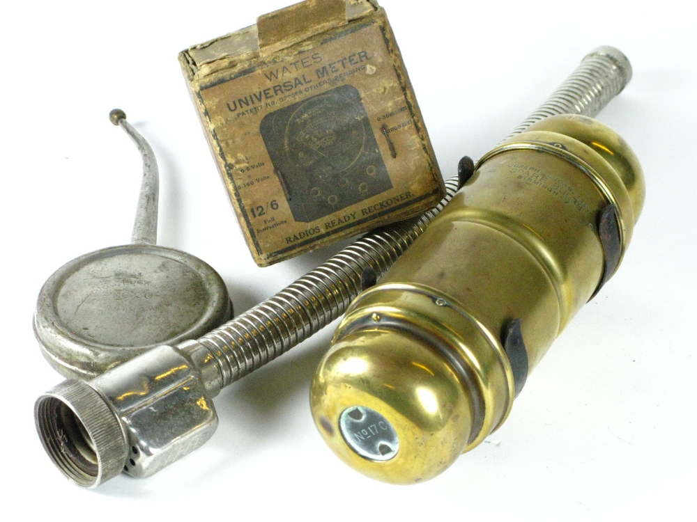 *A Lucas 17c spare bulb-holder. A brass cylinder with caps at both ends, with its firewall