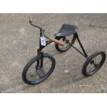 *A Child's Tricycle, having solid rubber tyres, rubber block pedals, wooden handlebar grips,