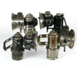 *Four small acetylene gas lamps, two versions of Lucas' 'Calcia Cadet' and two H. Miller & Co. lamps