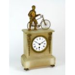 *Cyclist Mantle Clock. A late Victorian timepiece with a French pendulum movement in a white