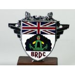 *B.R.D.C. A Racing Drivers' Club badge, inscribed 'Jonathan Buncome', with the S.C.H. Davis designed