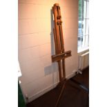 *A folding hardwood artist's easel, with adjustable brackets, approximately 155cm high (61