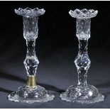 *Candlesticks. A pair of George III glass candlesticks, circa 1760-70, with facet cut stems on domed