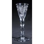 *Engraved glass. A George III wine glass, the bowl engraved with a cornucopia symbolising Peace