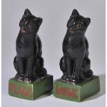 *Porcelain cats. A pair of WWI period porcelain cats, modelled as black cats seated on green